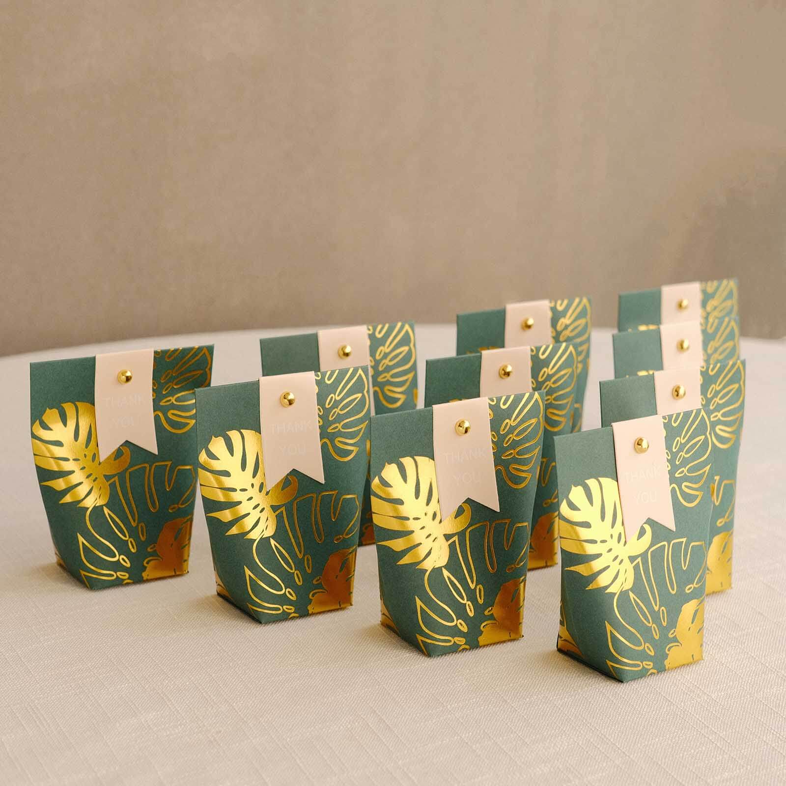 25 Pack Hunter Emerald Green Paper Pouch Candy Gift Bags With Gold Monstera Leaves Print, Party Favor Boxes with Pin and Tags - 4.5x4