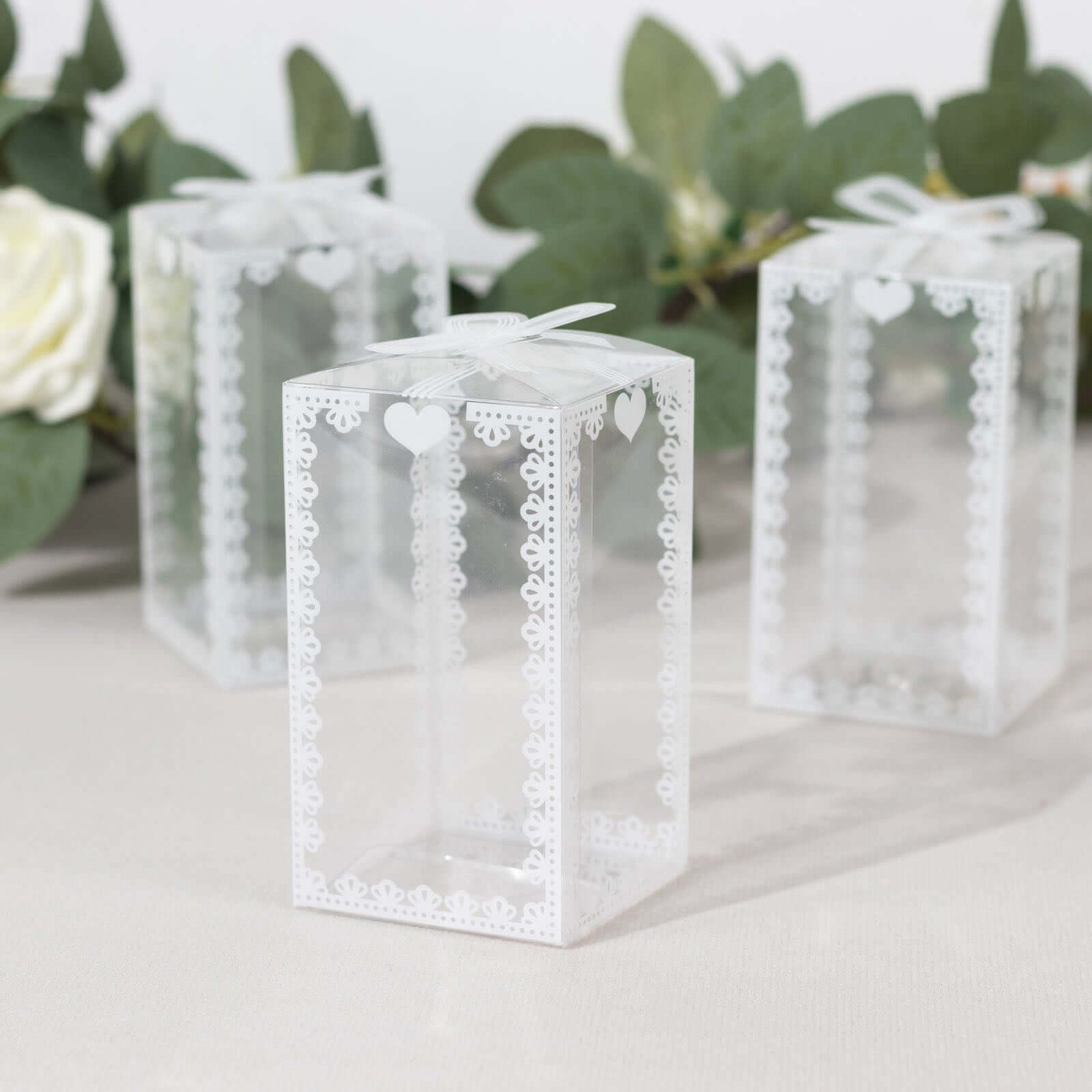 25 Pack Clear Rectangle Candy Gift Boxes With Bowknot and White Lace Pattern, 4 Transparent Plastic Party Favor Boxes - 2x2x4